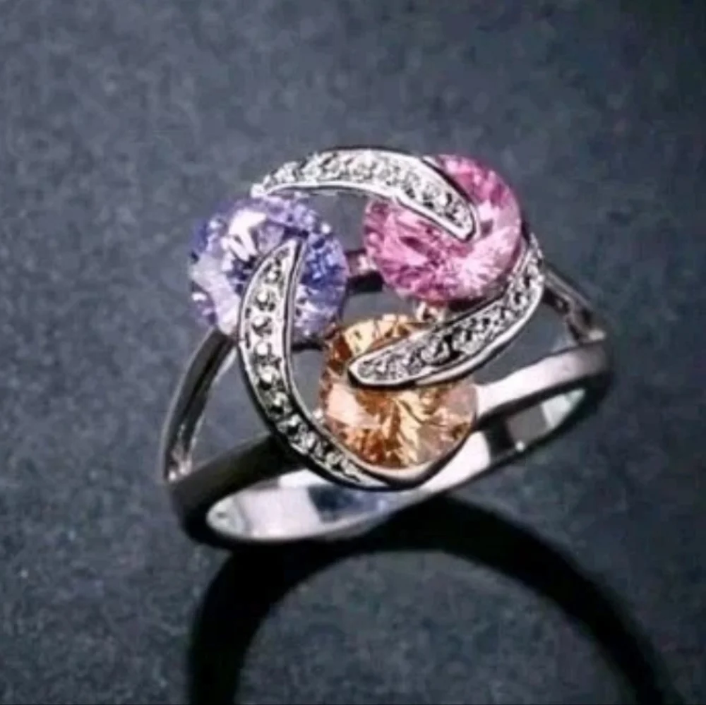 Sparkling Zirconia With Pink,yellow, and Purple Rotating Gemstone Design Sz 8